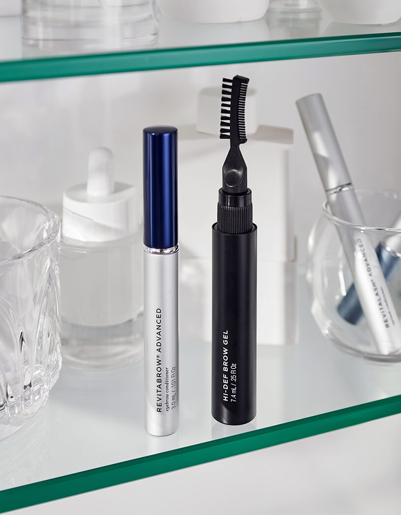 RevitaBrow Advanced and Hi-Def Brow Gel on glass counter 